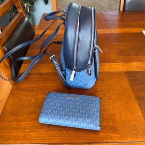 Michael Kors Medium sized back pain purse with wallet